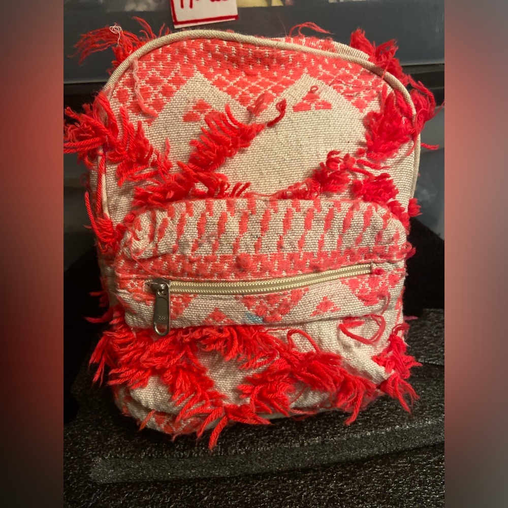 Coral Pink Shag Yarn Mini Backpack with Zip Around plus front zipper
Compartment